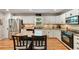 Charming kitchen with white cabinets, granite countertops, stainless steel appliances, and central island at 5107 Old Chestnut Ct, Woodstock, GA 30188