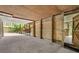 Covered outdoor patio with wood accents and sliding doors, seamlessly connecting indoor and outdoor living spaces at 5107 Old Chestnut Ct, Woodstock, GA 30188