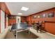 Finished recreation room features carpeted floors, recessed lighting, and ample space for entertaining and games at 5107 Old Chestnut Ct, Woodstock, GA 30188