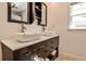 Modern bathroom with double vessel sinks, dark cabinetry, and brushed nickel faucets at 1082 Greenbriar Cir, Decatur, GA 30033