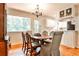 Dining room with hardwood floors, large windows, chandelier, and a decorative buffet at 1082 Greenbriar Cir, Decatur, GA 30033