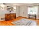Bright foyer with hardwood floors, large window, classic dresser, and closet for extra storage at 1082 Greenbriar Cir, Decatur, GA 30033
