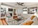 Inviting living room with fireplace, built-in shelving, ceiling fan, and comfortable seating arrangement at 1082 Greenbriar Cir, Decatur, GA 30033