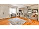 Open living room featuring hardwood floors, fireplace, built-in bookshelves, and comfortable seating at 1082 Greenbriar Cir, Decatur, GA 30033