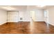 Finished basement boasts wood-look tile flooring, built-in shelving, and an exterior access door at 110 Randomwood Way, Alpharetta, GA 30022