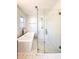 Modern bathroom with a sleek soaking tub and separate glass-enclosed shower featuring a subway tile design at 110 Randomwood Way, Alpharetta, GA 30022