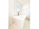 Modern soaking tub with sleek fixtures and stylish tile surround offering a relaxing spa-like experience at 110 Randomwood Way, Alpharetta, GA 30022
