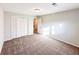Well-lit bedroom with a closet and doorway, creating a versatile and welcoming space at 110 Randomwood Way, Alpharetta, GA 30022
