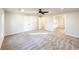 Bright bedroom with a ceiling fan, neutral carpet, and a view into a walk-in closet at 110 Randomwood Way, Alpharetta, GA 30022