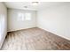 Bright bedroom with neutral carpet, natural light from a window, and a cozy, inviting atmosphere at 110 Randomwood Way, Alpharetta, GA 30022
