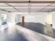 Expansive garage space with smooth flooring and plenty of room for parking and storage at 110 Randomwood Way, Alpharetta, GA 30022