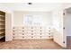 Walk-in closet features custom storage solutions, including built-in cabinets and shelving at 110 Randomwood Way, Alpharetta, GA 30022