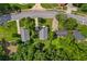 An aerial view showcases the house among lush trees and surroundings in a residential area at 1751 Thomasville Se Dr, Atlanta, GA 30315