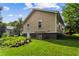 Exterior shot of the home's backyard with nice green grass and a view of the home at 1751 Thomasville Se Dr, Atlanta, GA 30315