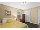 Comfortable bedroom featuring hardwood floors, a picture window, and neutral décor at 1751 Thomasville Se Dr, Atlanta, GA 30315