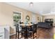 Charming dining area with table, four chairs, natural light and view of the living room at 1751 Thomasville Se Dr, Atlanta, GA 30315