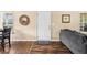Inviting entryway with a decorative mirror, neutral walls, and view to the dining area at 1751 Thomasville Se Dr, Atlanta, GA 30315
