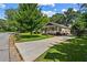 Inviting single-story home featuring a front porch, neat landscaping, and a spacious driveway at 1751 Thomasville Se Dr, Atlanta, GA 30315