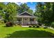 Charming single story home boasting a welcoming front porch and manicured landscaping at 1751 Thomasville Se Dr, Atlanta, GA 30315