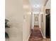 Hallway with wood floors and neutral walls leading to various rooms in the home at 1751 Thomasville Se Dr, Atlanta, GA 30315