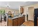 Kitchen with wood cabinets, double sink, and view to dining area at 1751 Thomasville Se Dr, Atlanta, GA 30315