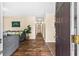 Cozy living room with hardwood floors, comfortable seating, and a view into the hallway at 1751 Thomasville Se Dr, Atlanta, GA 30315
