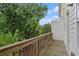 Balcony with wood railings offering scenic views of lush greenery and blue skies at 1192 Wylie Se St # 429, Atlanta, GA 30316