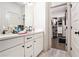 Bathroom featuring a double vanity, and view of a walk-in closet at 1192 Wylie Se St # 429, Atlanta, GA 30316