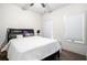 Bedroom with a comfortable queen bed and two large windows at 1192 Wylie Se St # 429, Atlanta, GA 30316
