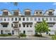 Modern townhome row boasts clean white facades, upper-level decks, and convenient garage access at 1192 Wylie Se St # 429, Atlanta, GA 30316
