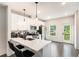 Bright kitchen equipped with stainless steel appliances, white cabinetry, and convenient breakfast bar at 1192 Wylie Se St # 429, Atlanta, GA 30316