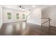Sunlit living space featuring hardwood floors, neutral walls, with a staircase leading to the next level at 1192 Wylie Se St # 429, Atlanta, GA 30316