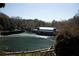 Large outdoor amphitheater with rows of green seating and a stage, perfect for concerts and outdoor performances at 156 Lake Forrest Ne Ln, Atlanta, GA 30342