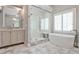 Bathroom with marble floors, walk-in glass shower, and a double sink vanity at 156 Lake Forrest Ne Ln, Atlanta, GA 30342