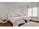 Bedroom with two twin beds, hardwood floors, and neutral decor at 156 Lake Forrest Ne Ln, Atlanta, GA 30342