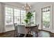 Breakfast nook with round table, hardwood floors, windows, and lots of natural light at 156 Lake Forrest Ne Ln, Atlanta, GA 30342
