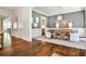 Elegant dining room with gray walls, wainscoting, chandelier, and a rustic wooden table at 156 Lake Forrest Ne Ln, Atlanta, GA 30342