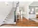 Inviting foyer with elegant staircase, hardwood floors, and neutral decor at 156 Lake Forrest Ne Ln, Atlanta, GA 30342