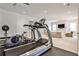 Well-equipped home gym with state-of-the-art fitness equipment and access to a relaxing sitting area at 156 Lake Forrest Ne Ln, Atlanta, GA 30342