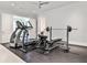Spacious home gym featuring a ceiling fan, ample space for exercise, and a range of fitness equipment at 156 Lake Forrest Ne Ln, Atlanta, GA 30342