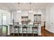 Bright, open kitchen featuring a marble island, stainless steel appliances, and custom white cabinets at 156 Lake Forrest Ne Ln, Atlanta, GA 30342