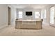 Living room with a large sofa, fireplace, and multiple windows offering plenty of light at 156 Lake Forrest Ne Ln, Atlanta, GA 30342