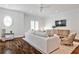 Spacious living room with hardwood floors, modern furnishings, and natural light at 156 Lake Forrest Ne Ln, Atlanta, GA 30342
