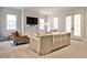 Living room with a plush sofa, fireplace, and french doors at 156 Lake Forrest Ne Ln, Atlanta, GA 30342