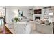 Bright living room with a fireplace, built-in shelves, and comfortable seating at 156 Lake Forrest Ne Ln, Atlanta, GA 30342