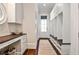 Mud room with built-in cubbies, dark wood floors, and ample storage space at 156 Lake Forrest Ne Ln, Atlanta, GA 30342