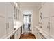 Hall pantry with custom cabinets, counter space, a sink and wine fridge; access to dining room at 156 Lake Forrest Ne Ln, Atlanta, GA 30342