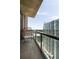 Balcony features a wicker chair with views of a high-rise building at 270 17Th Nw St # 2210, Atlanta, GA 30363