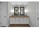 Bathroom features a double vanity with granite countertops and shaker style cabinets at 270 17Th Nw St # 2210, Atlanta, GA 30363