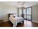 Bedroom with large windows providing natural light and city views, complemented by hardwood floors at 270 17Th Nw St # 2210, Atlanta, GA 30363